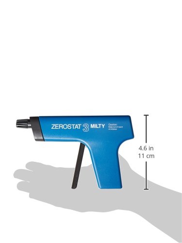 Milty Zerostat in hand near vinyl, battery-free anti-static treatment for cleaner playback