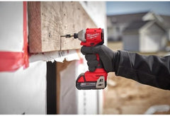 Milwaukee M18TRADE driving a screw in a cabinet installation demonstrating precise, cordless performance