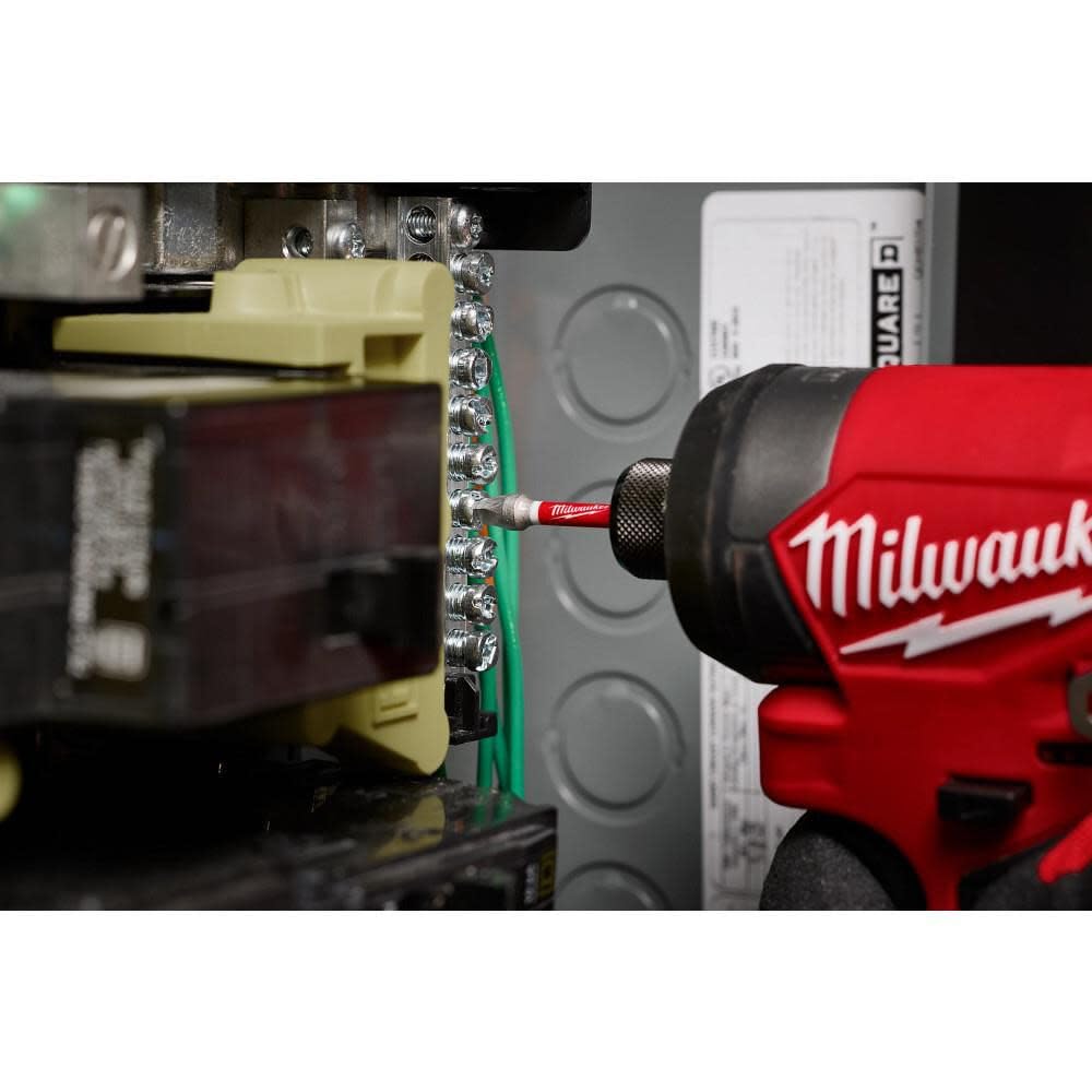 Milwaukee bits next to a hand for scale showing compact, portable kit