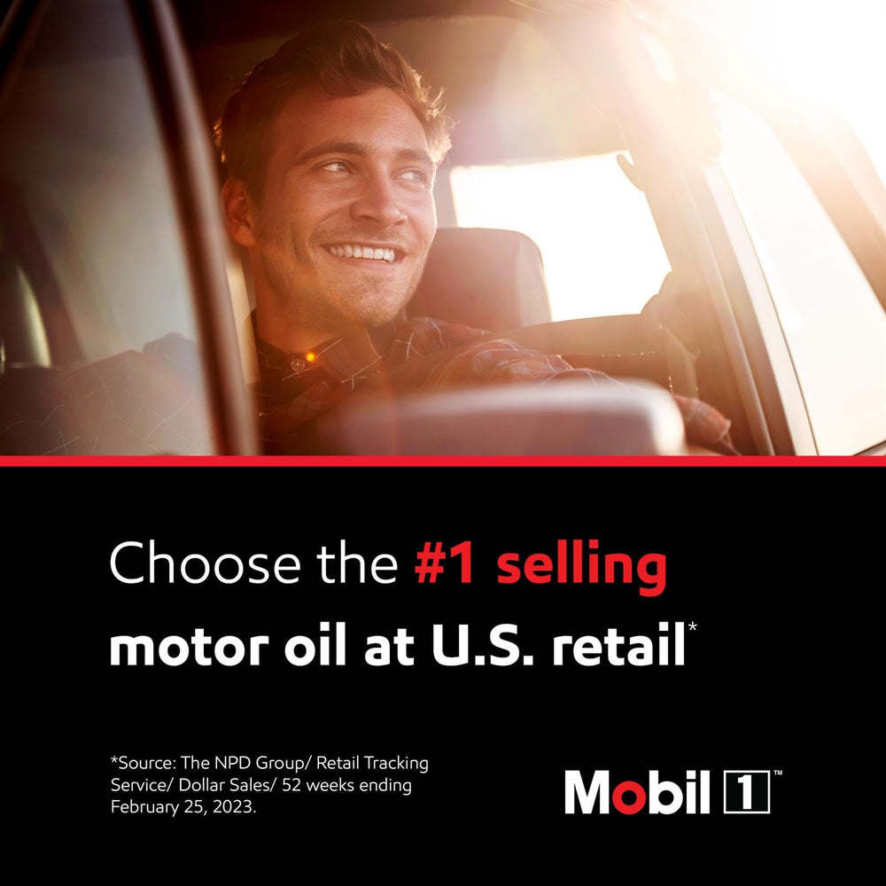 Mobil 1 bottle next to hand for size comparison and easy handling during service