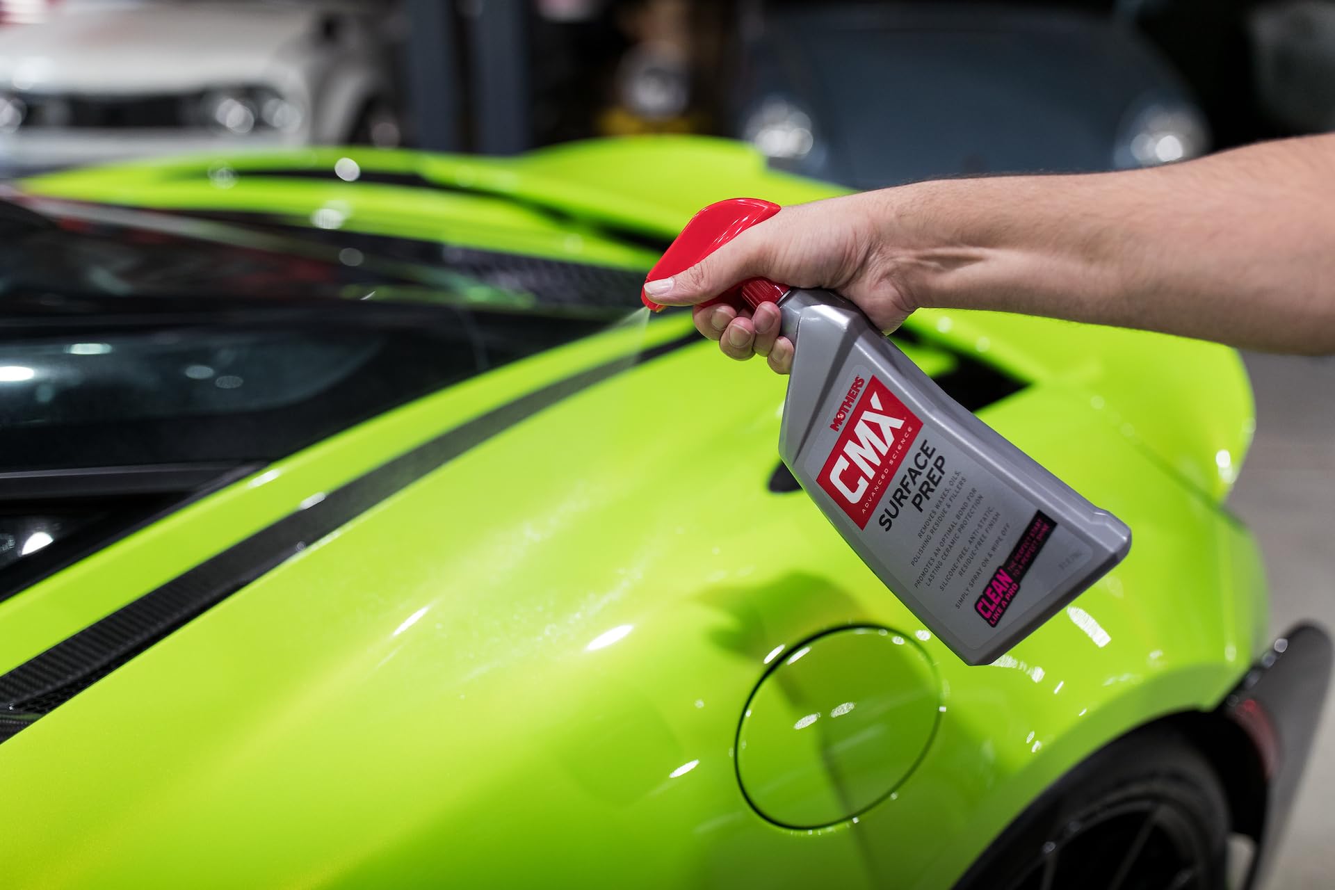 Mothers being sprayed onto car paint, demonstrating fast cleaning action benefit