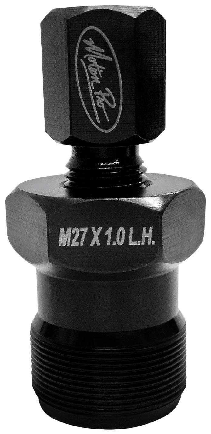 Motion Pro tool threaded into flywheel during removal demonstrating secure fit and damage prevention