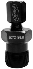 Motion Pro tool threaded into flywheel during removal demonstrating secure fit and damage prevention