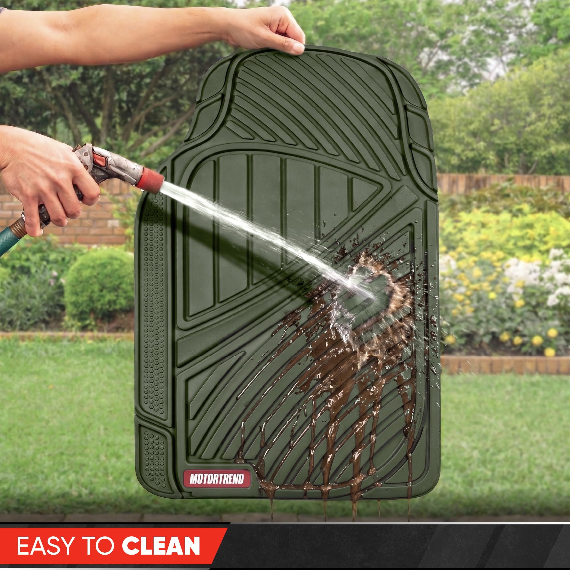 Motor Trend mat being hosed off for fast, easy cleaning