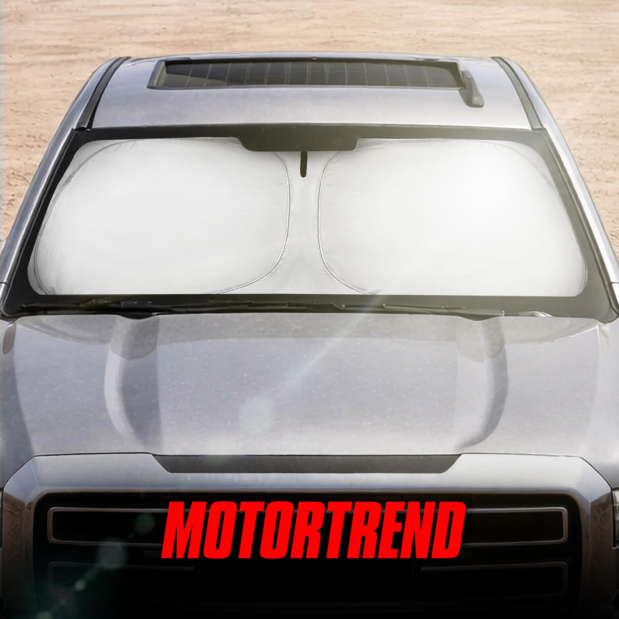 Motor Trend lifestyle view of parked truck showing sunshade in use