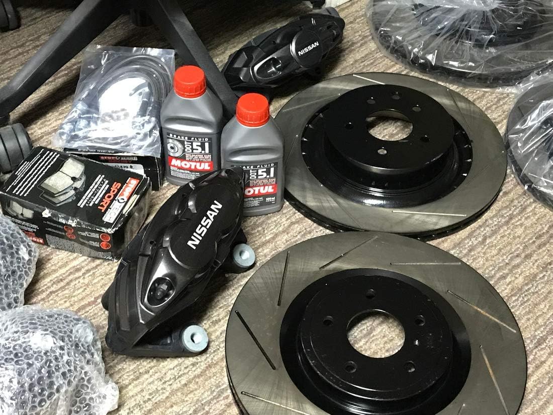Motul DOT 5.1 bottle next to ruler for scale, showing 500ml size for accurate purchase decision