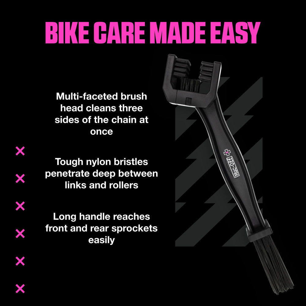 Muc-Off brush next to a hand to show size and convenient storage benefit