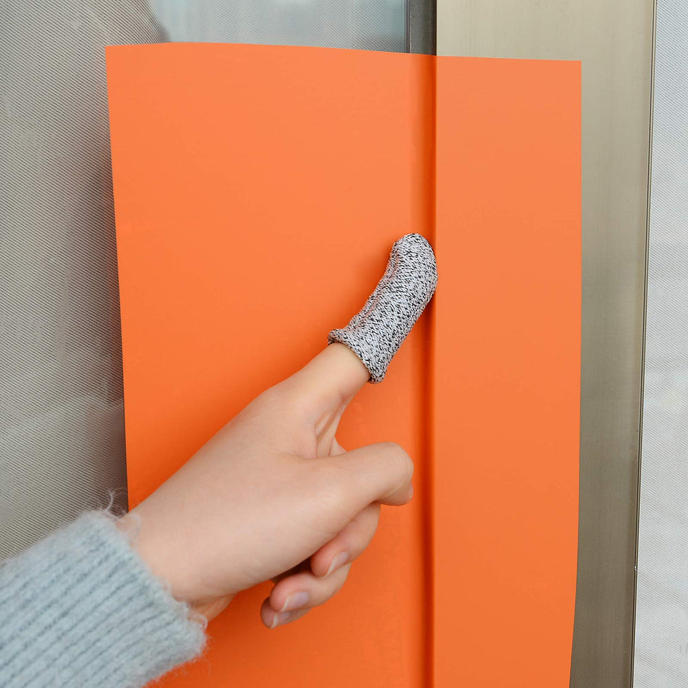 NEWISHTOOL installer using tape at workbench for efficient workflow