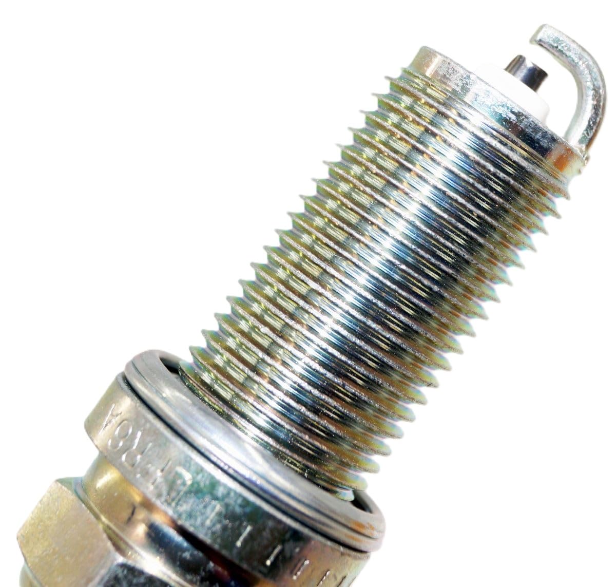 NGK 3672 spark plugs held in hand demonstrating correct size and fit clarity
