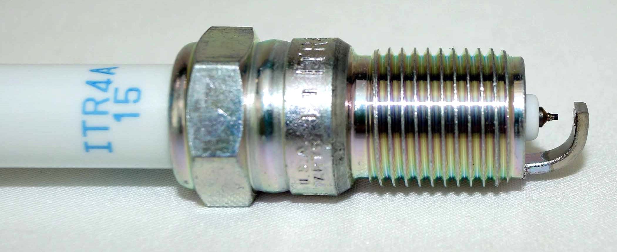 NGK opened pack of eight plugs displaying contents and organized packaging