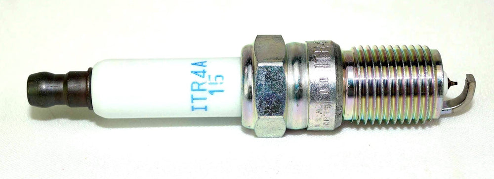 NGK spark plugs held in hand showing size and scale for quick comparison