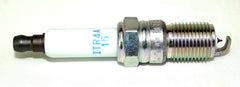 NGK spark plugs held in hand showing size and scale for quick comparison