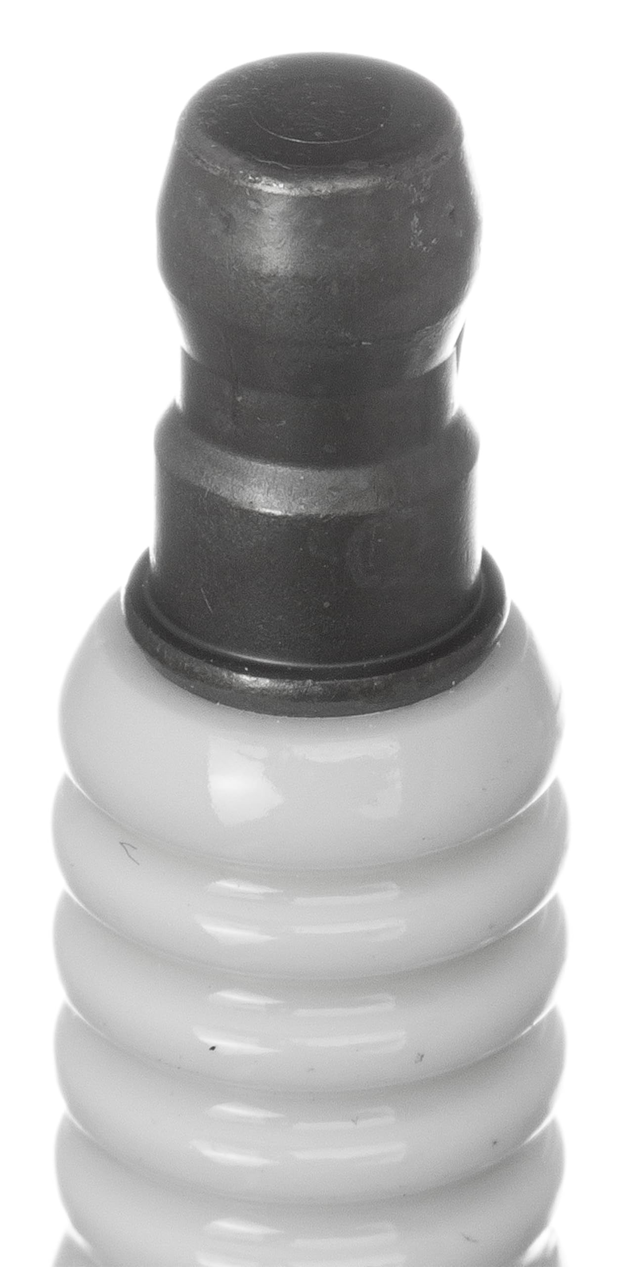 NGK spark plug installed in engine showing proper fit and improved ignition benefit