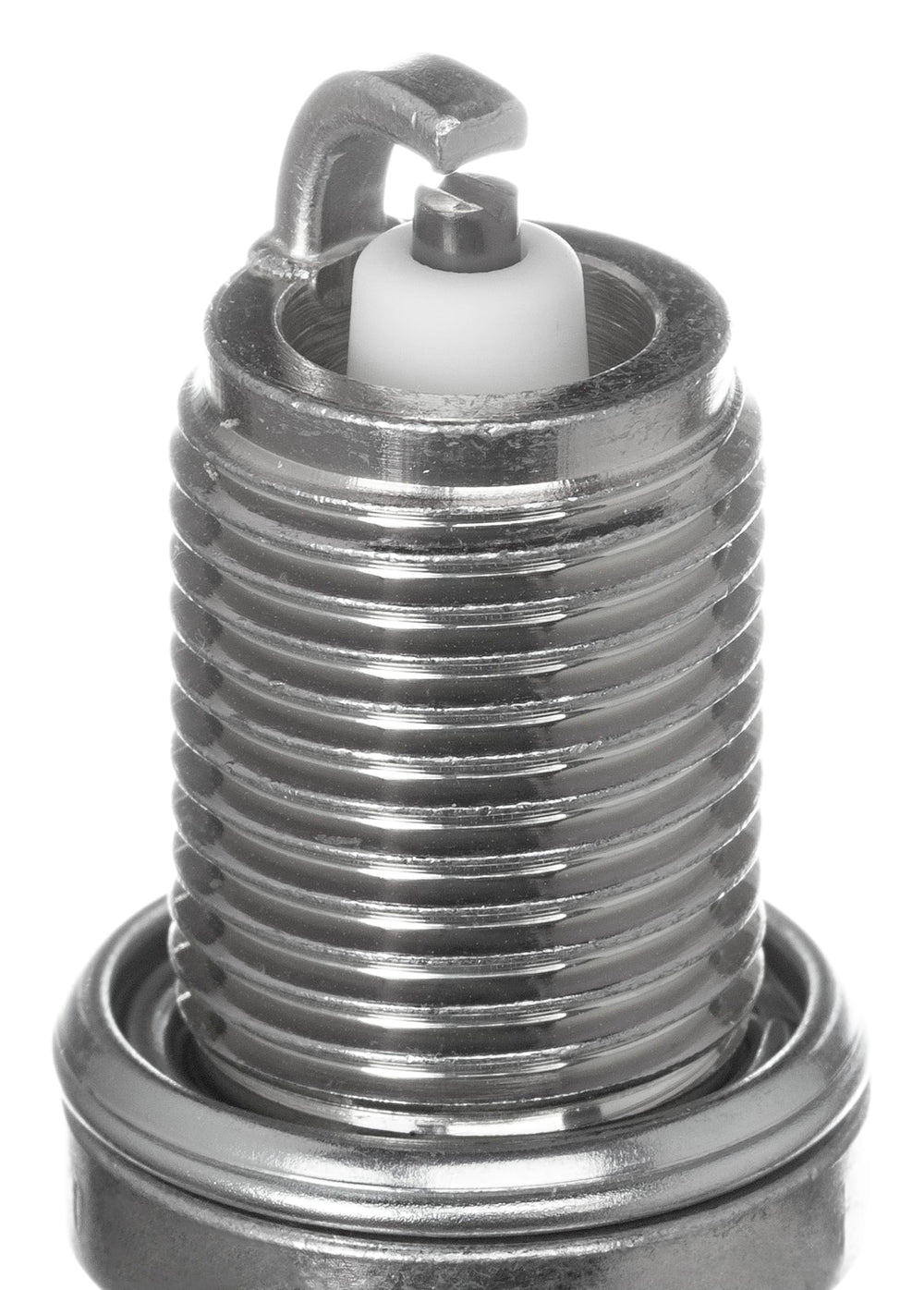 NGK spark plug beside ruler for scale showing correct reach and fitment benefit