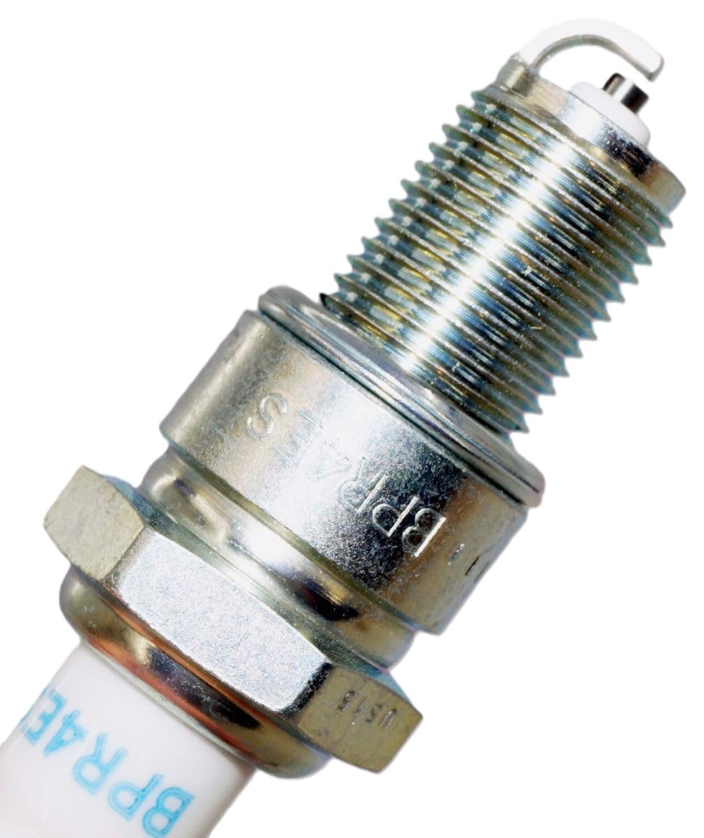 NGK plug installed in engine pictured during service to indicate correct fit and benefit