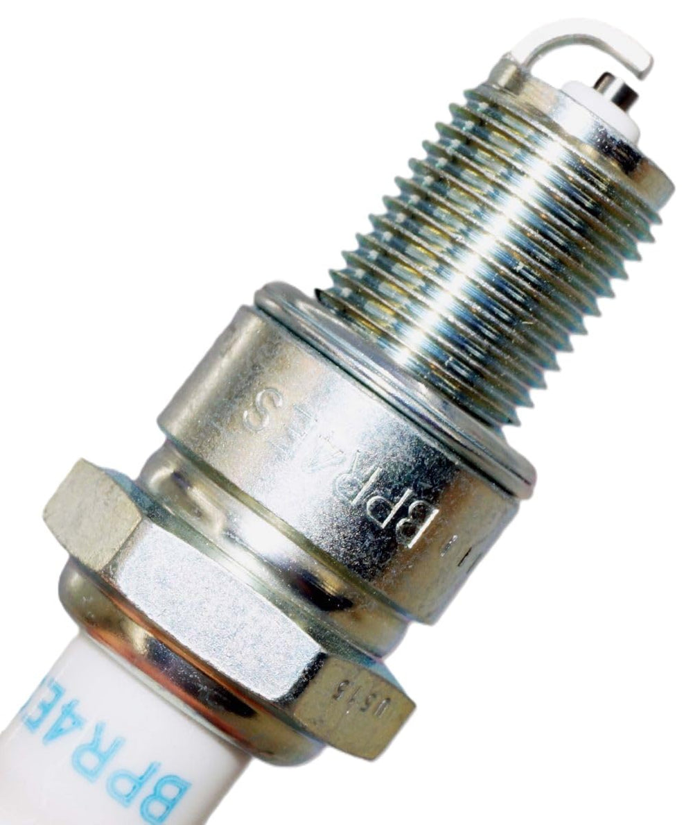NGK plug installed in engine pictured during service to indicate correct fit and benefit