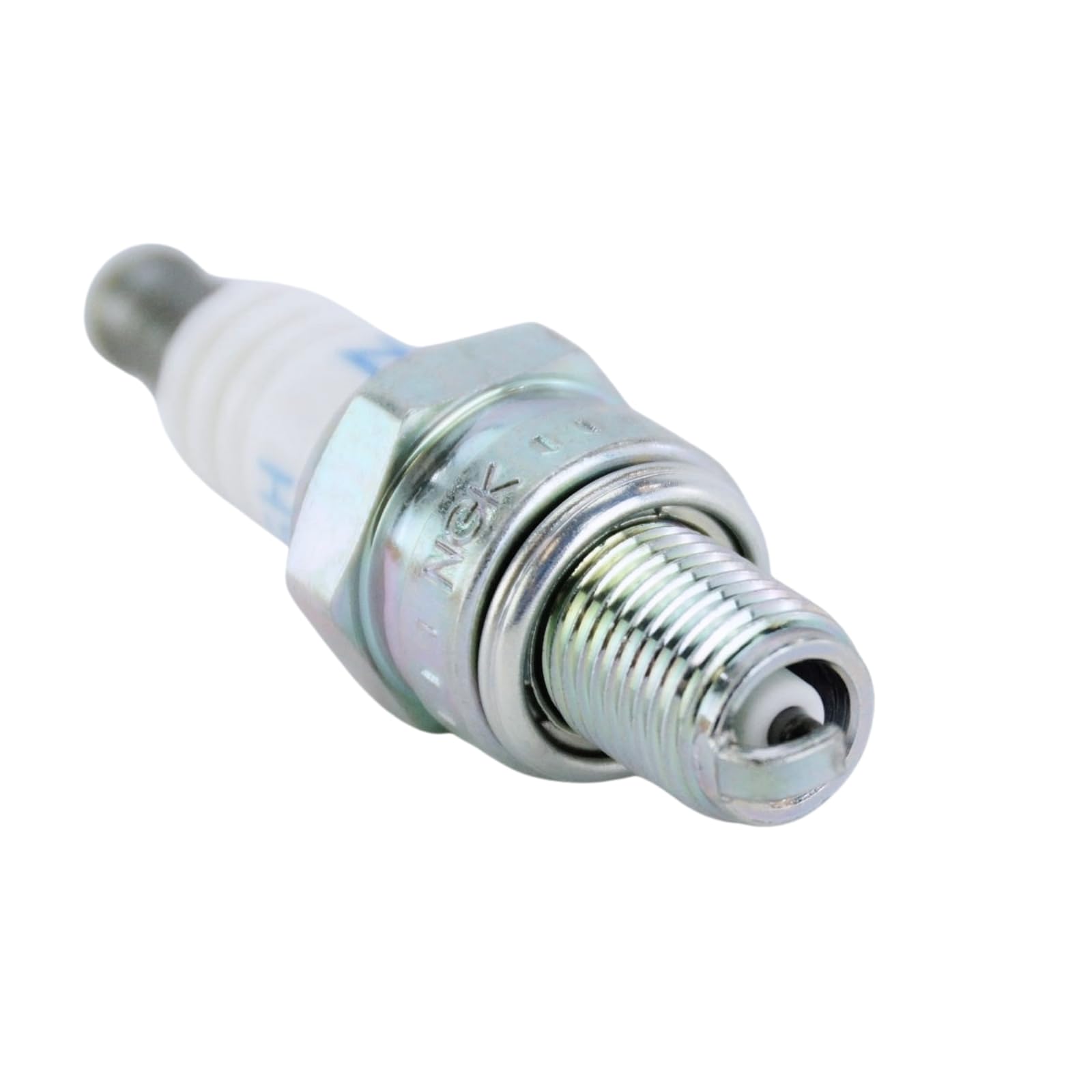 NGK CMR6H installed in a chainsaw spark plug hole showing proper fit and easy maintenance