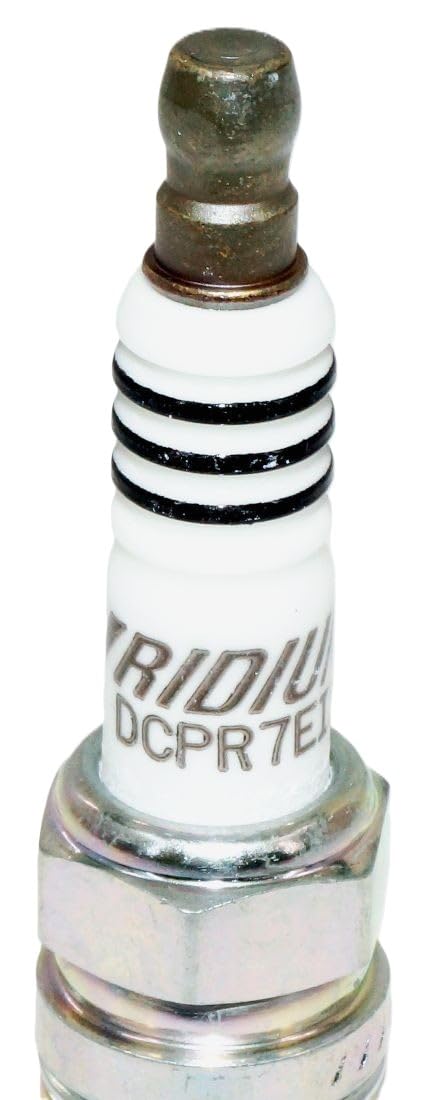 NGK DCPR7EIX installed in engine cylinder head, demonstrating reliable combustion benefit