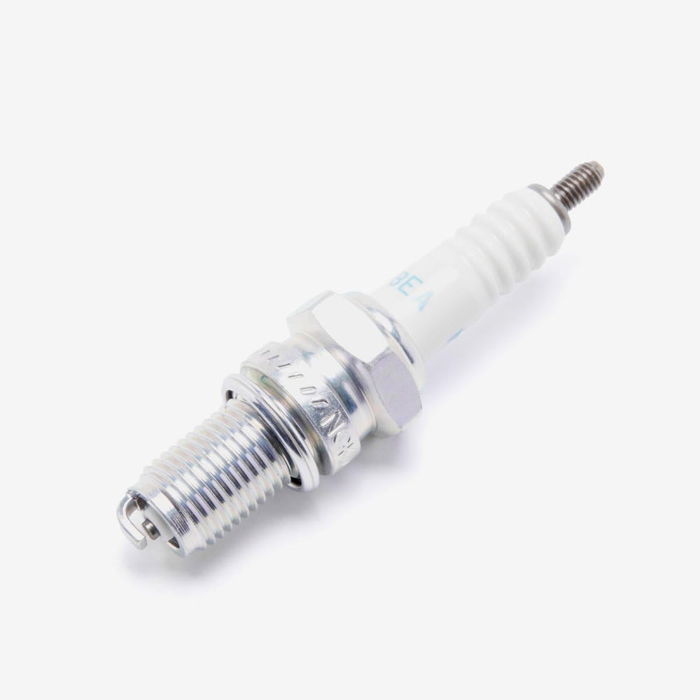Close-up of NGK DR8EA electrode and porcelain insulator illustrating quality fit and finish