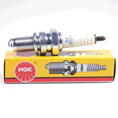 NGK DR8EA spark plug installed in engine cylinder head demonstrating correct fitment
