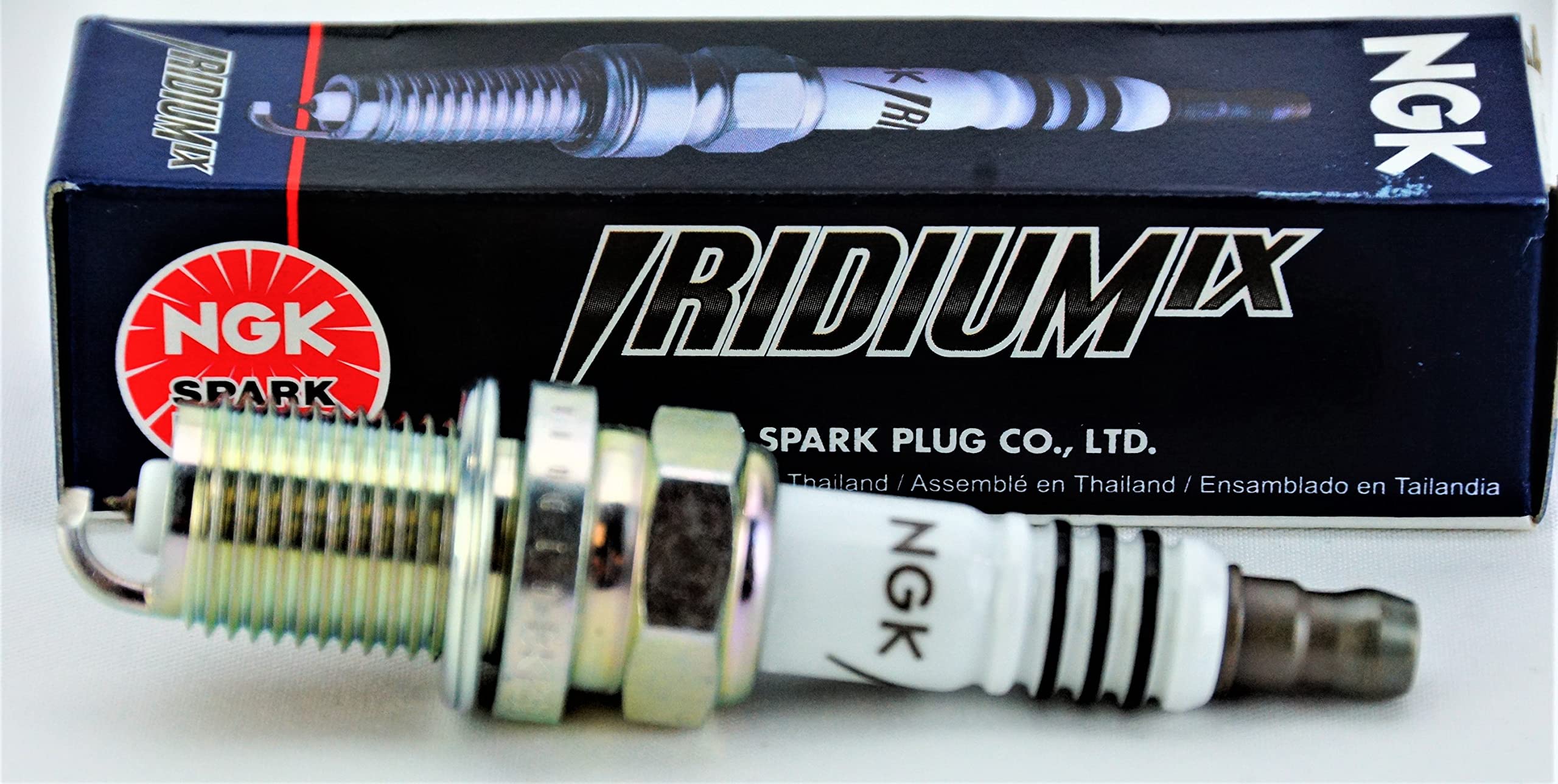 NGK four plugs arranged to illustrate complete kit and installation readiness