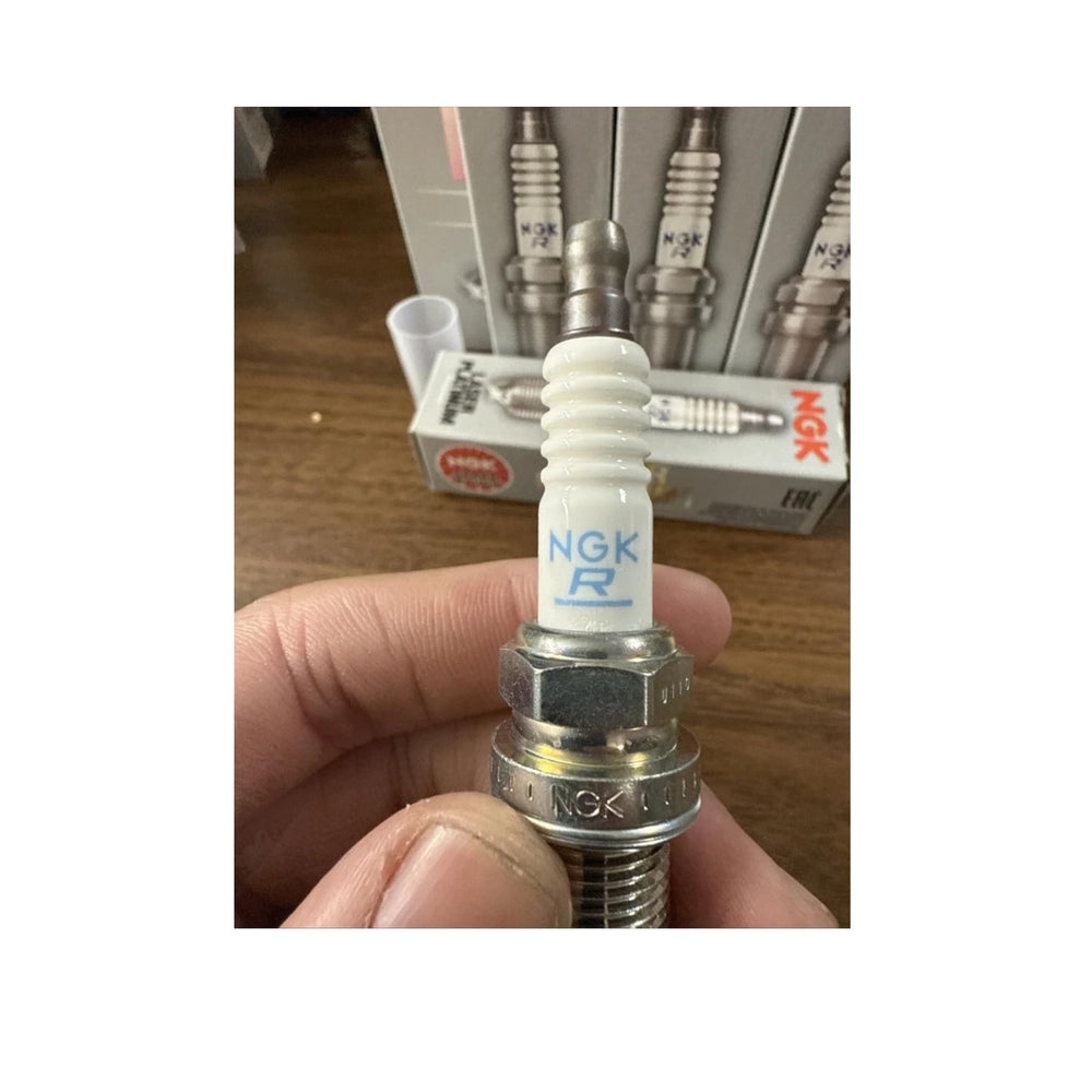 NGK spark plug installed in engine bay demonstrating proper application