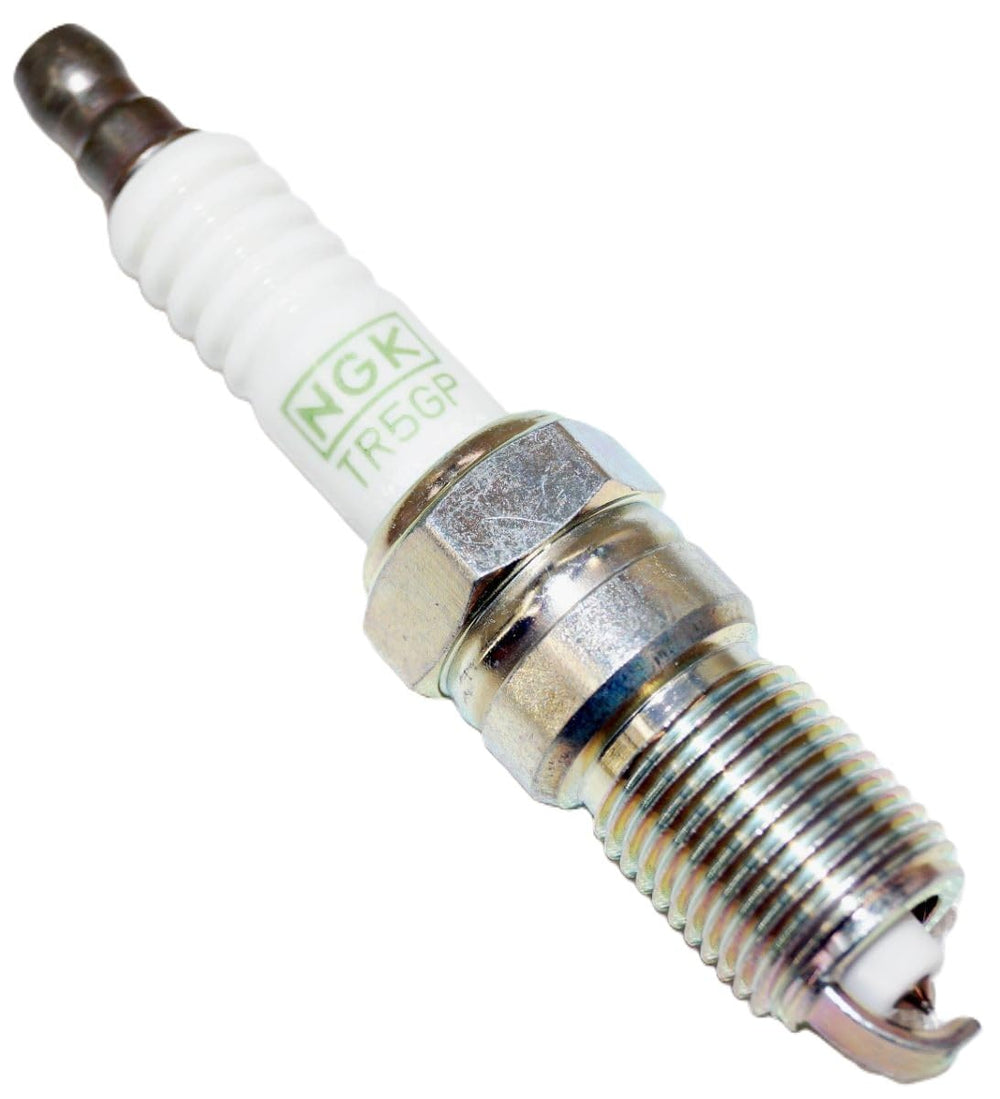 NGK plugs lined up to show uniform construction and consistent replacement compatibility