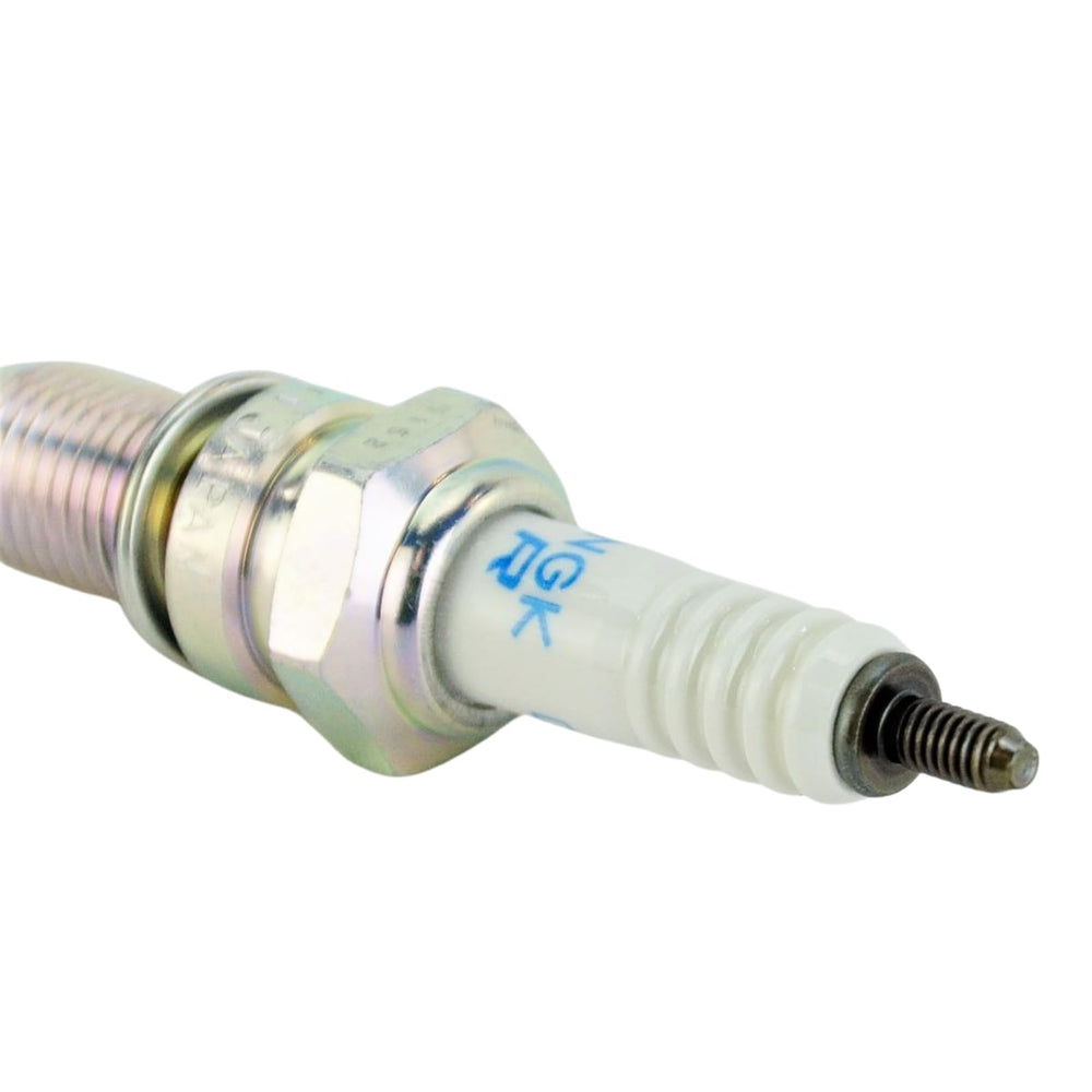 NGK spark plug installed in engine cylinder head illustrating proper fit and reliability