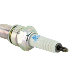 NGK spark plug installed in engine cylinder head illustrating proper fit and reliability