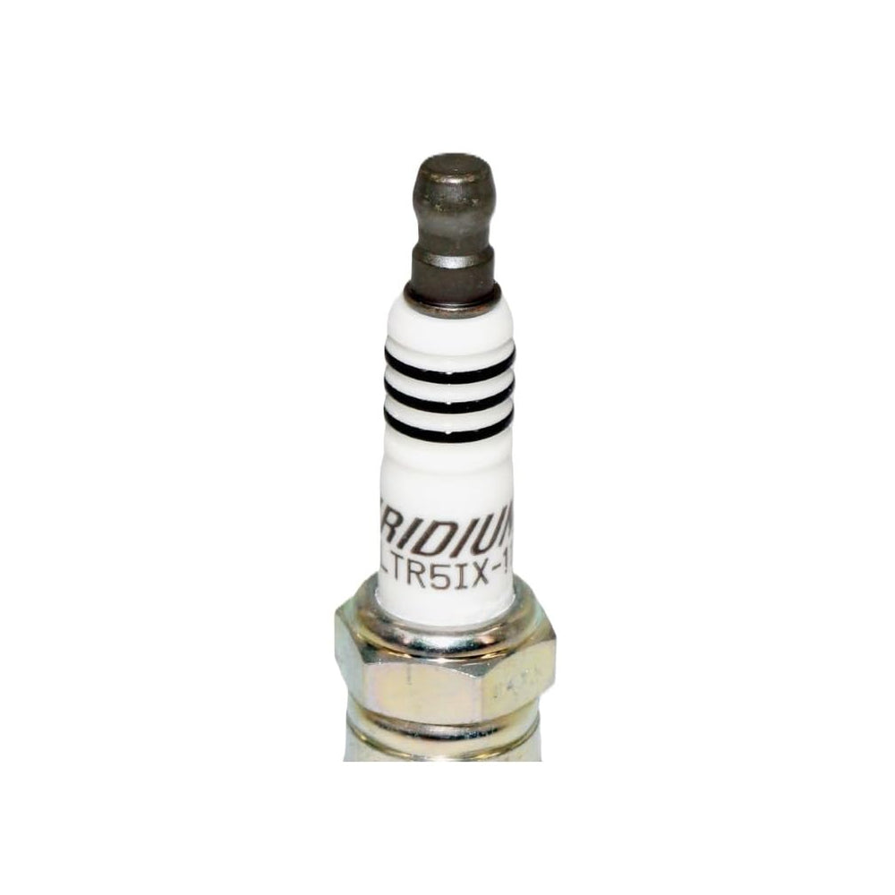 NGK spark plug installed in engine cylinder head illustrating easy replacement benefit