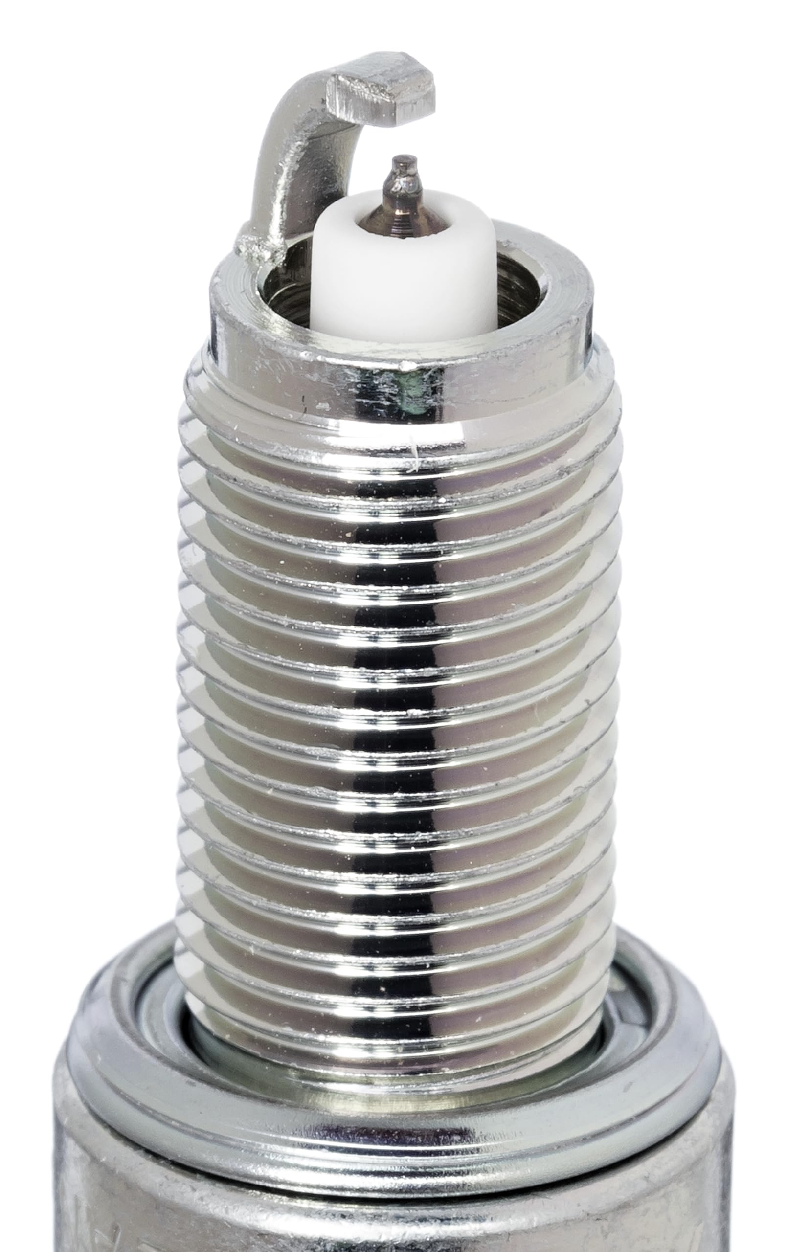 NGK iridium IX spark plug installed in engine bay demonstrating fitment