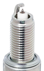 NGK iridium IX spark plug installed in engine bay demonstrating fitment