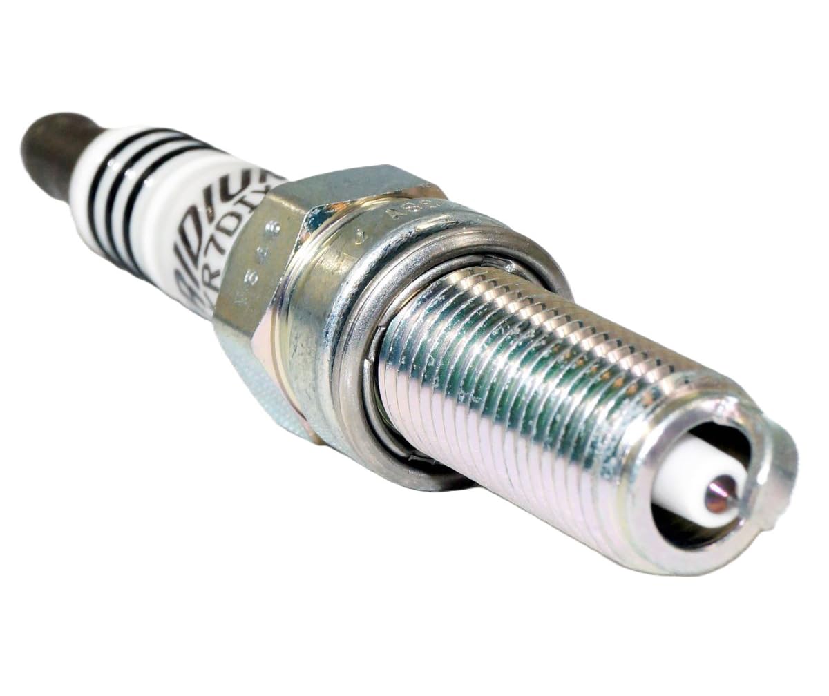 NGK plug held in hand demonstrating compact size and fit