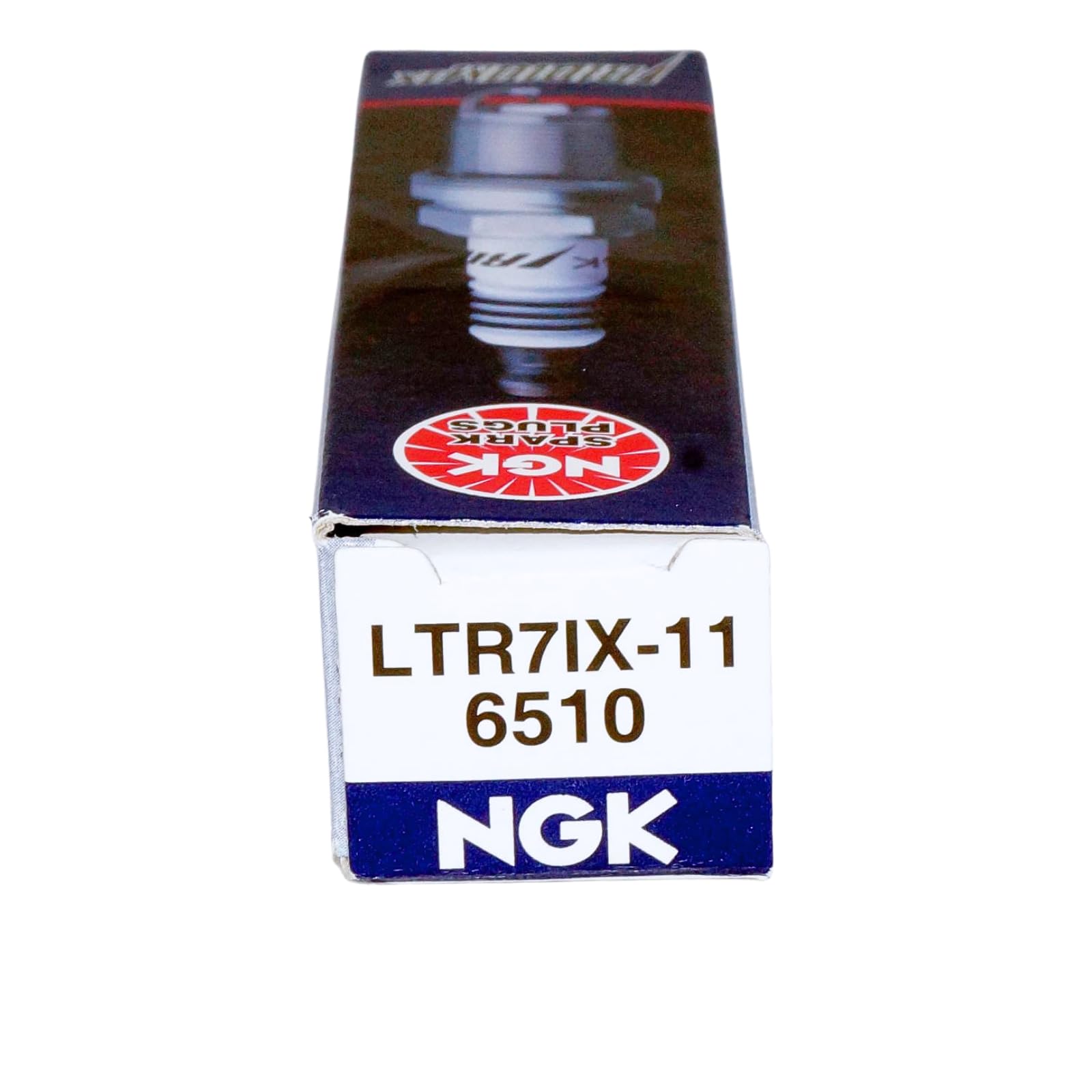 NGK plug beside ruler for size and thread comparison and fitment assurance