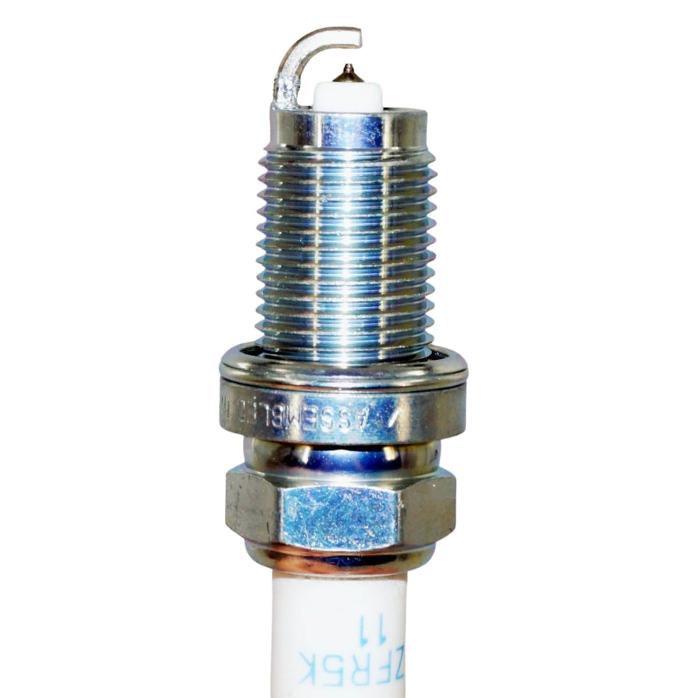 NGK spark plug installed in engine bay demonstrating direct-fit compatibility and neat installation