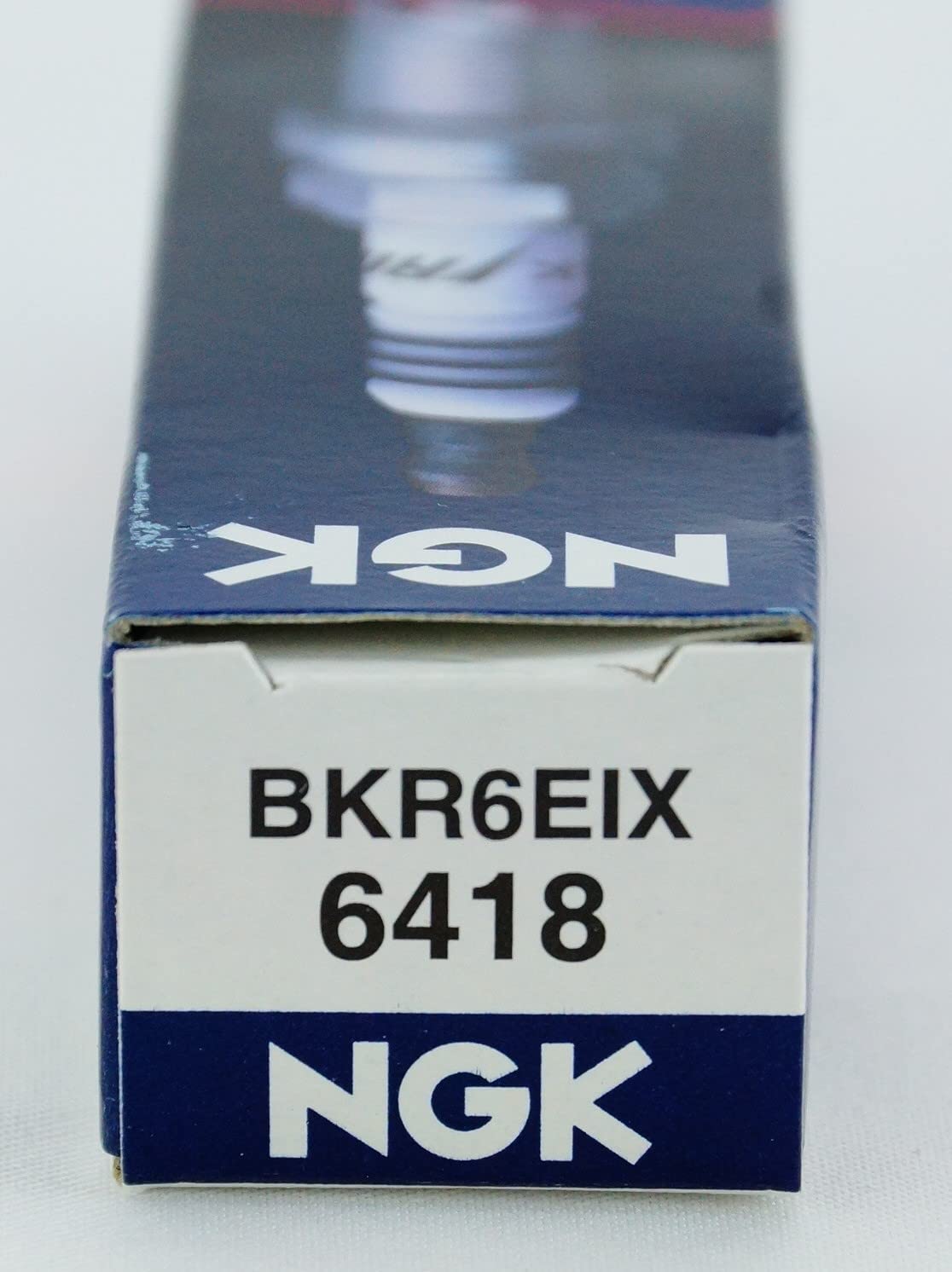 NGK plug installed in engine showing correct fit and dependable ignition
