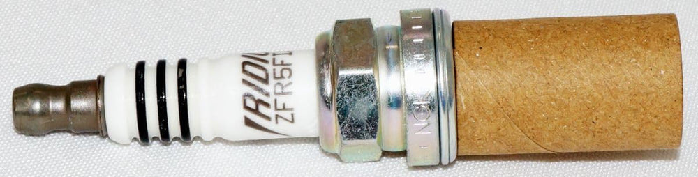 NGK spark plug with correct gap ready for accurate installation