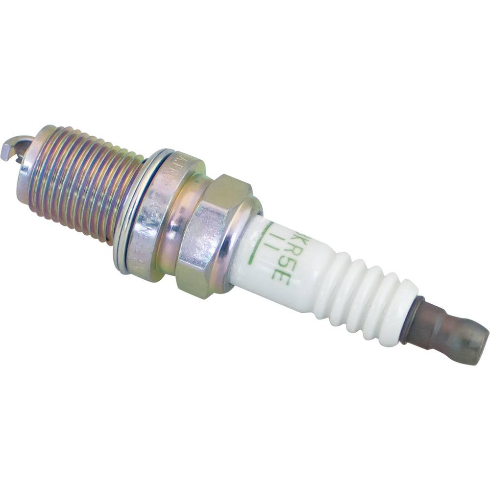 NGK spark plug installed in engine compartment showing fitment benefit