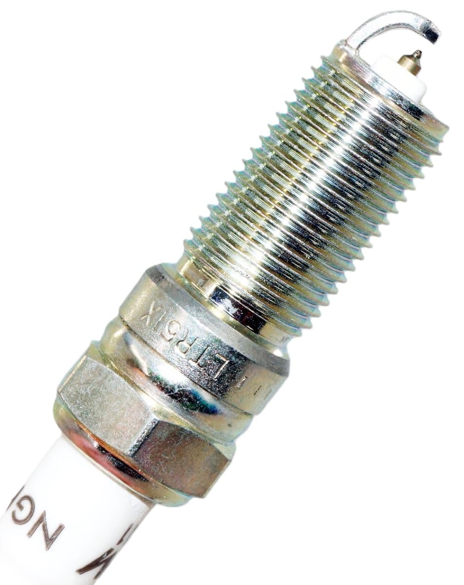NGK spark plug beside ruler for size and scale comparison ensuring correct fitment