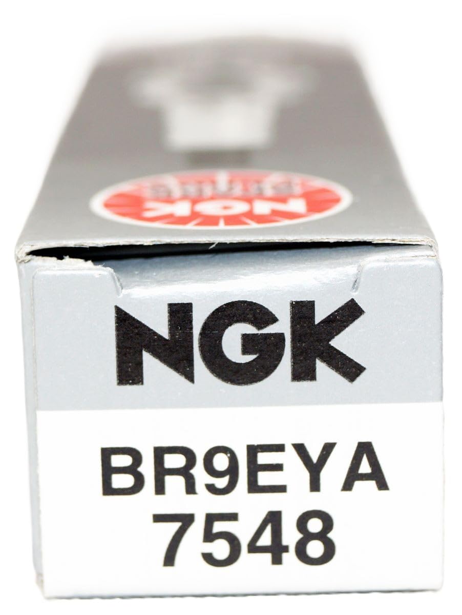 NGK spark plug next to ruler showing size and fitment scale clarity