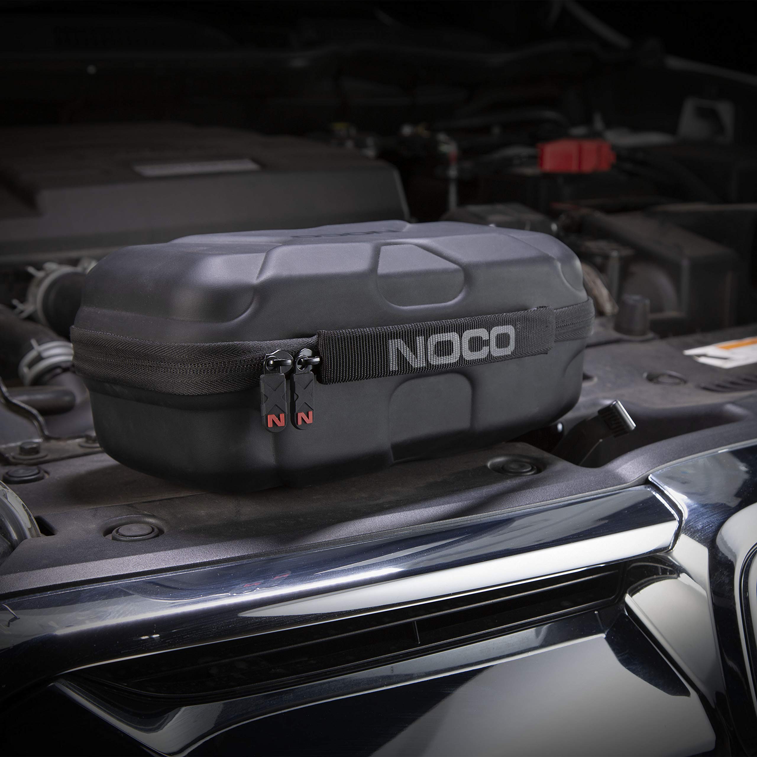 NOCO interior pouch with charging cable and clamps organized for readiness