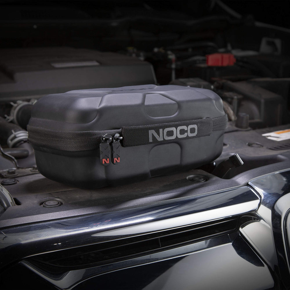 NOCO interior pouch with charging cable and clamps organized for readiness