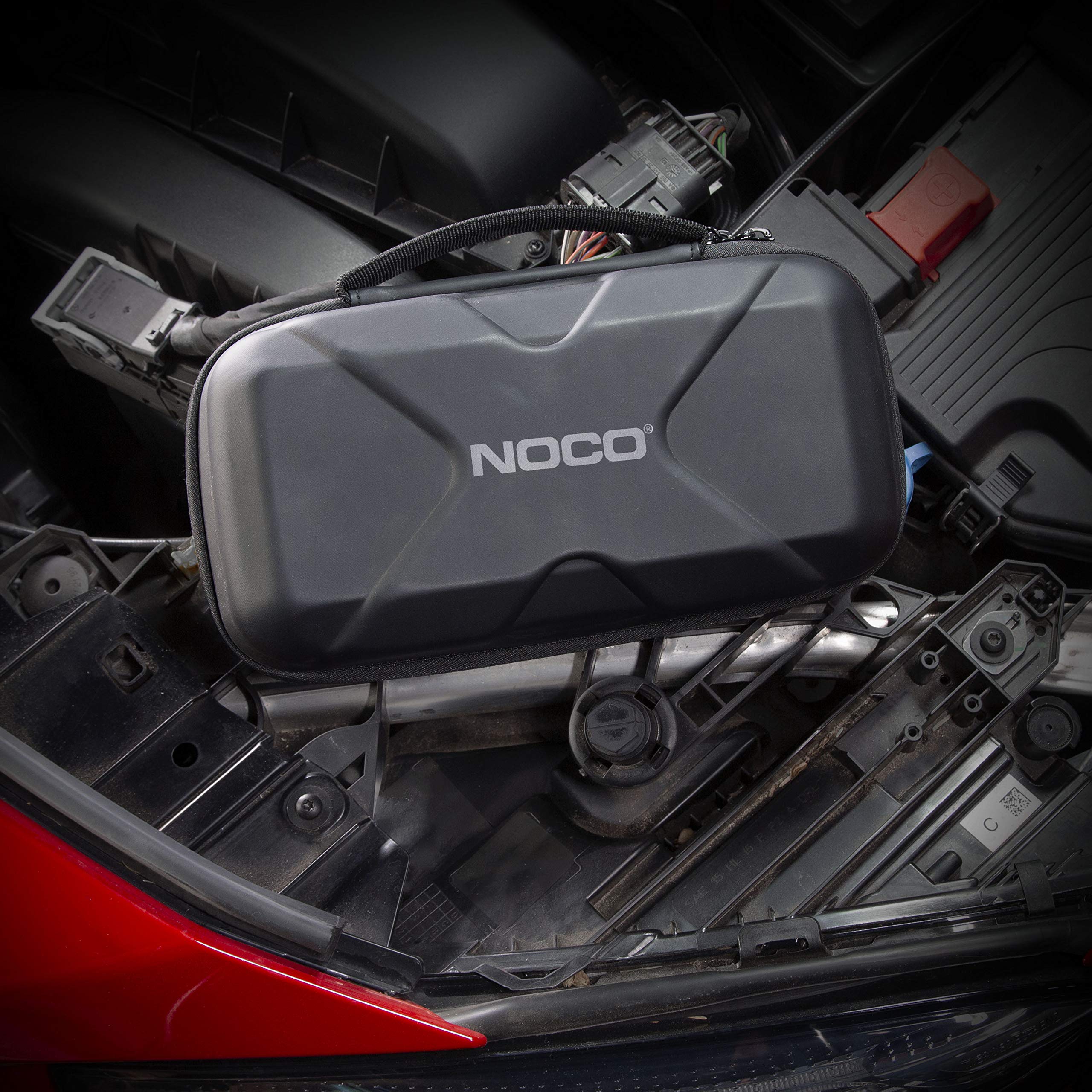 NOCO Boost XL case in glovebox illustrating space-saving vehicle storage