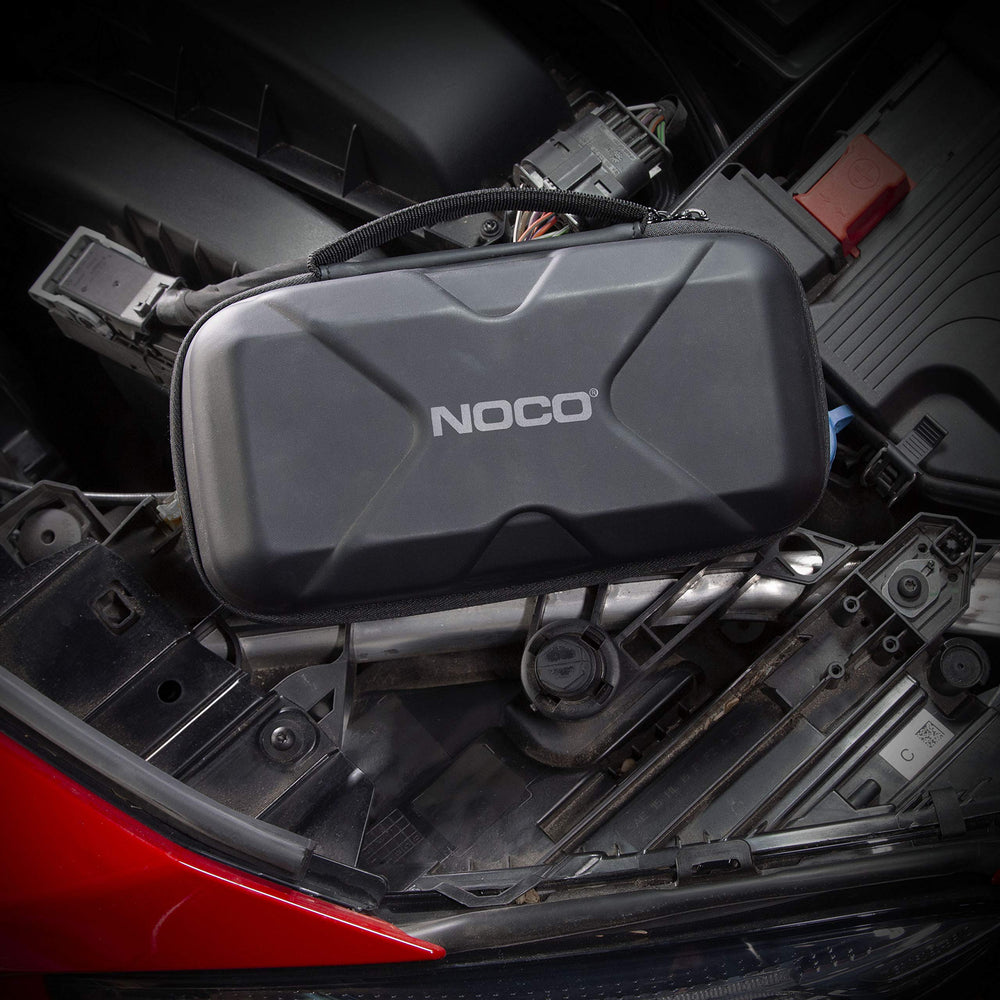 NOCO Boost XL case in glovebox illustrating space-saving vehicle storage