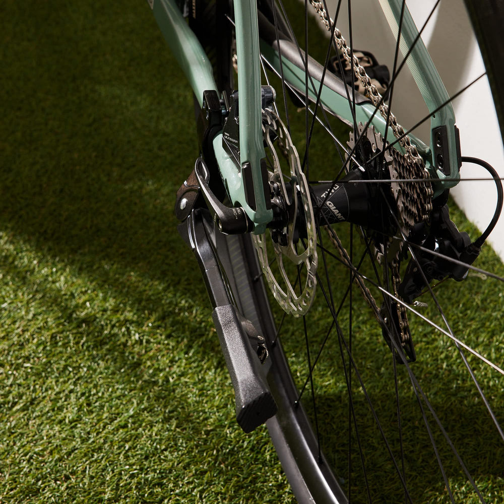 N+1 kickstand on parked bicycle in street setting highlighting everyday usability