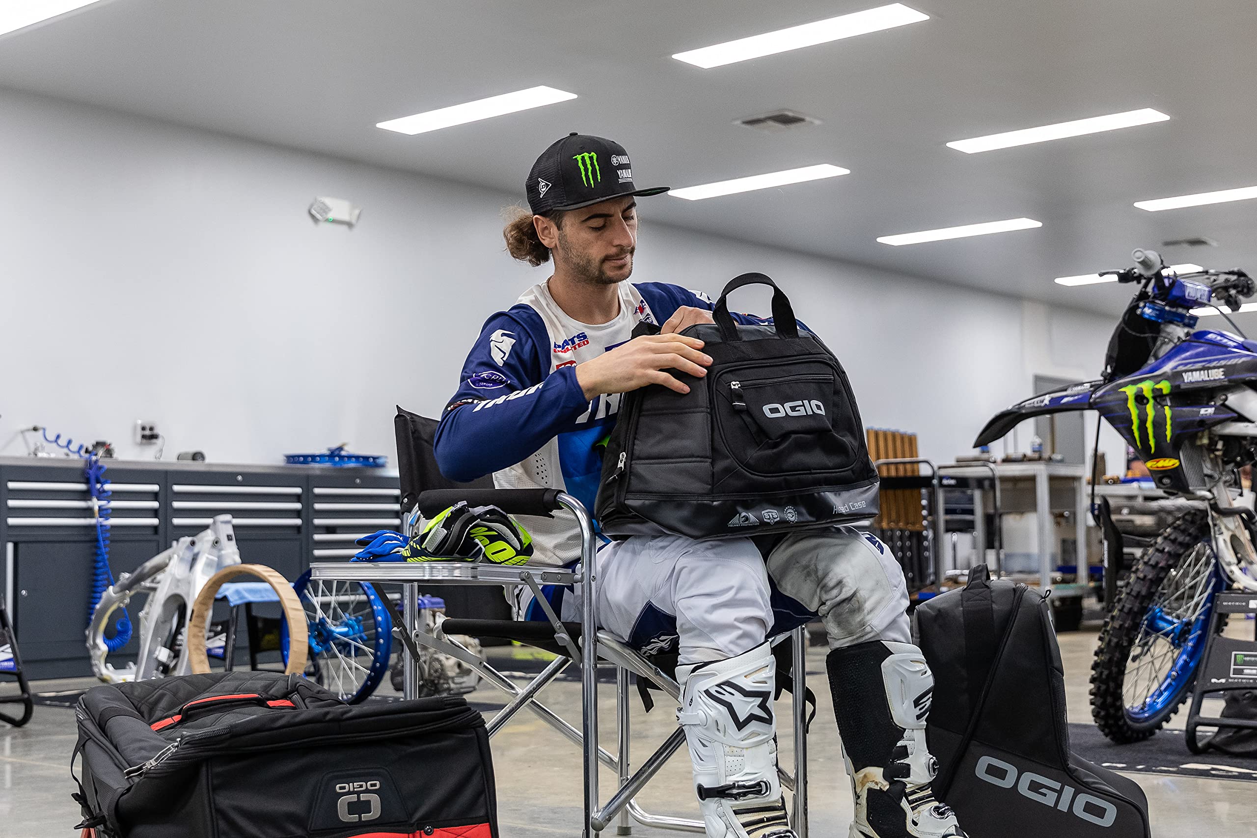 OGIO bag beside a helmet showing scale and easy transport benefit