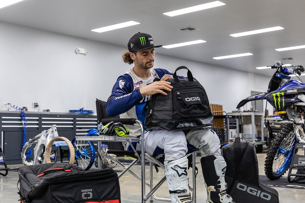 OGIO bag beside a helmet showing scale and easy transport benefit
