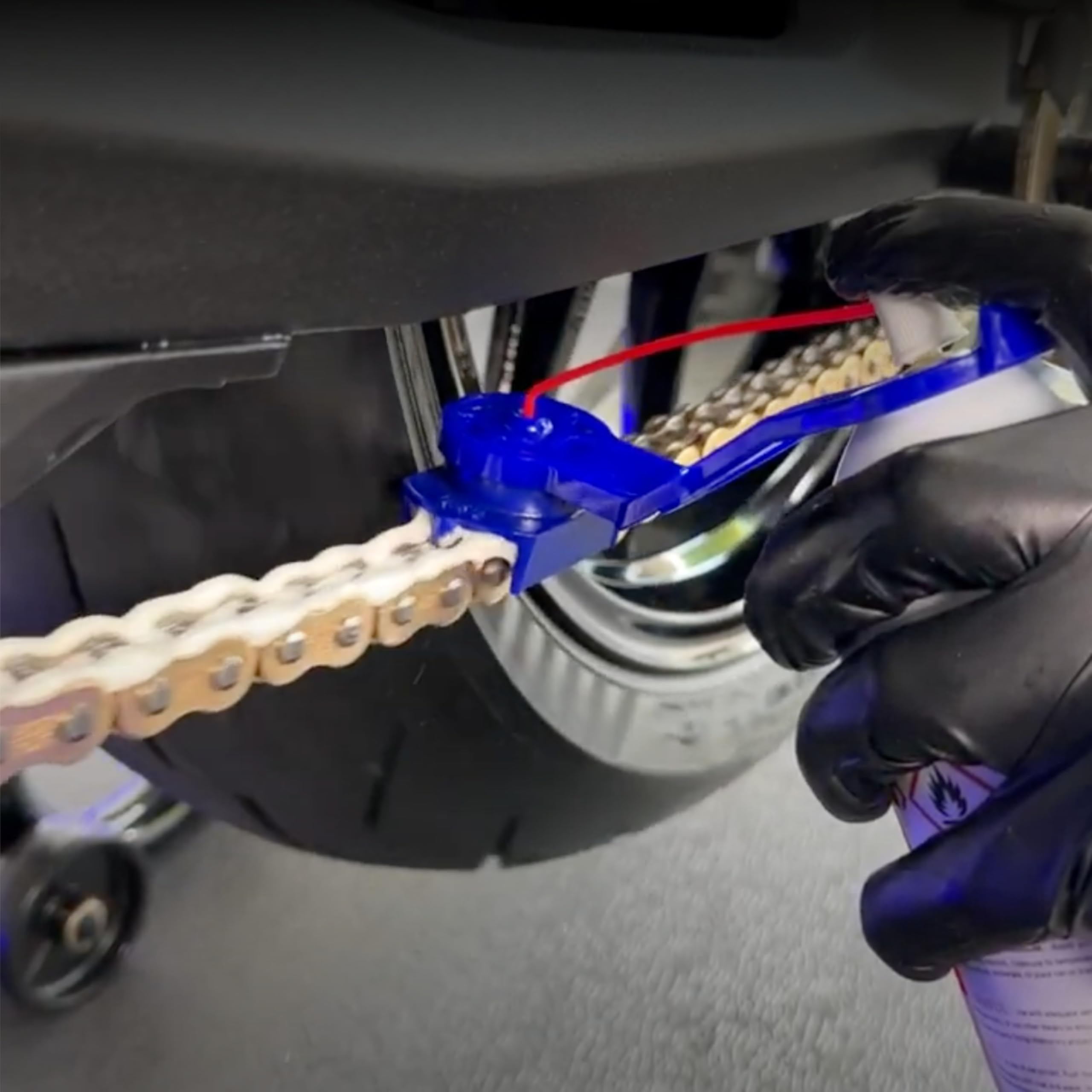 Oinker dispenser close-up highlighting precise nozzle alignment for accurate lube