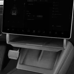 Old Rock installed front view under Model Y screen, adds hidden storage benefit