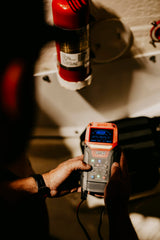 OPTIMA D400+ connected to a car battery demonstrating safe maintenance benefit